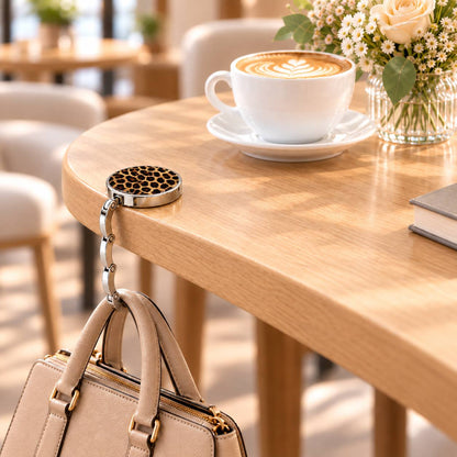 Gancho plegable estampado para bolso - colgador portátil para bolsos de mesa